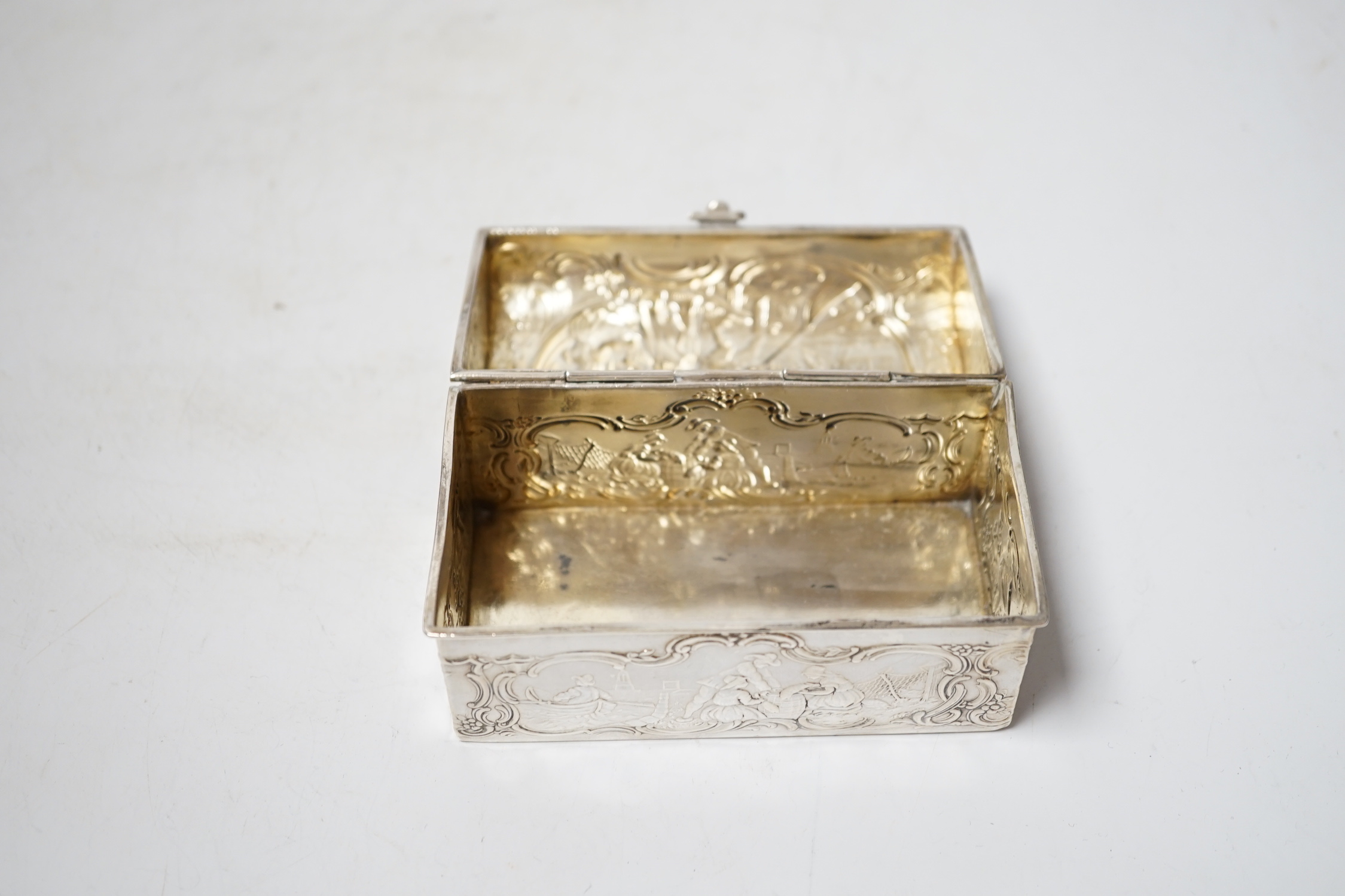 An early 20th century repousse Hanau silver box, modelled as a travelling trunk, import marks for Berthold Muller, Chester, 1903, width, 10cm.